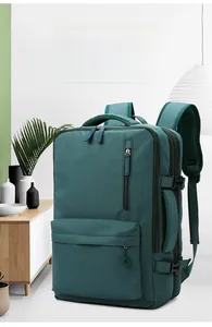 Macro shot of dark green nylon laptop backpack showing side buckles and thick handles