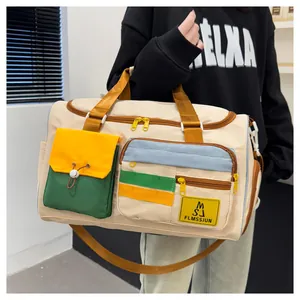 Detailed view of spacious nylon travel bag with multi-functional pockets on model