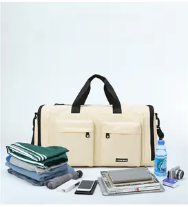 Detail view of large travel bag with multiple pockets and organized storage space