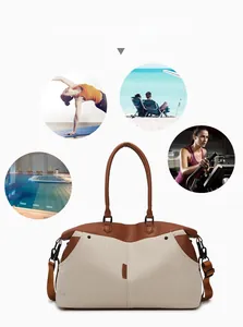 Detail of large canvas travel bag with leather handles and multi-scene sport icons
