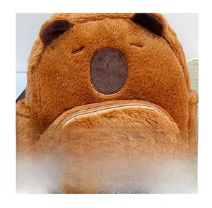 Close-up of plush capybara backpack featuring soft brown fur and star-shaped pocket detail