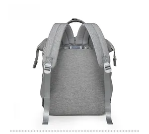 Detailed back view of a grey diaper backpack with wide padded straps and top handle