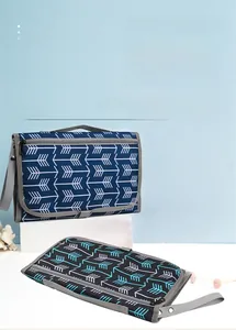 Detail of portable waterproof baby changing mat showing foldable design and durable straps