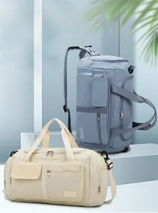 Multiple storage pockets and adjustable straps of a large capacity travel fitness bag