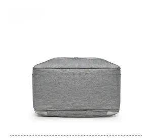 Detailed bottom view of the large capacity diaper backpack in grey polyester fabric