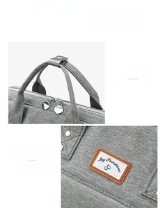 Detail view of the soft grey textile handles and My Sunshine cherry logo patch