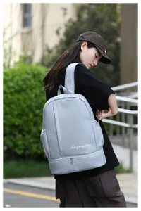 Detail of light grey waterproof travel backpack featuring dry wet separation storage bag