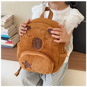 Detail showing plush capybara backpack with zipper pocket and soft brown fabric texture