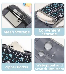 Detail view of portable diaper pad with mesh storage pockets and waterproof fabric