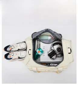 Detailed view of travel bag compartments showing large capacity with shoes and gear