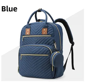 Detail view of the deep blue mummy backpack featuring V-shaped quilting and storage layers
