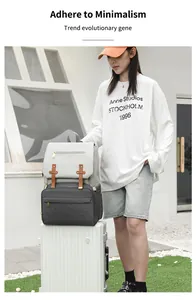 Detail of grey multi-functional diaper backpack on suitcase with USB charging port
