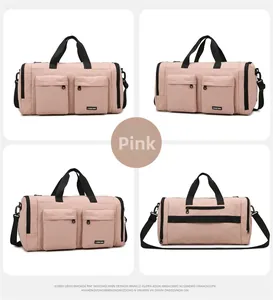 Pink multi-pocket travel bag featuring a separate shoe compartment and suitcase strap