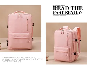Detail view of pink travel backpack with dual zippers, mesh straps, and large capacity
