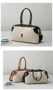 Detail of large canvas travel bag with leather trim and detachable shoulder strap
