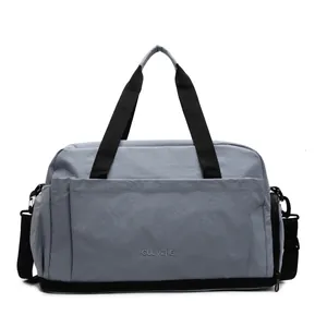 Sac de voyage fitness bleu-gris avec compartiment à chaussures et bandoulière