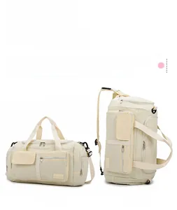 Detail of cream travel bag showing hand carry and backpack mode with waterproof fabric