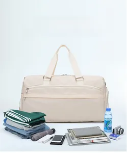 Spacious interior of beige waterproof travel bag showing multiple organized storage compartments