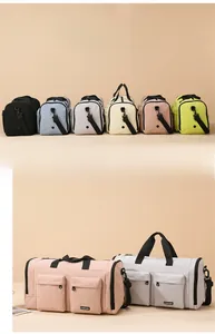 Detail view of large multi-pocket travel duffel bag with durable straps and brand logo