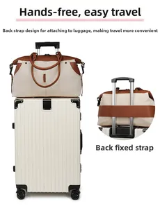 Canvas travel bag featuring a back strap designed to fit over luggage trolley handles