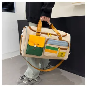 Detail of colorful large capacity travel bag with multiple pockets and durable nylon handles