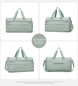 Detail view of large green waterproof travel bag with multiple compartments and straps