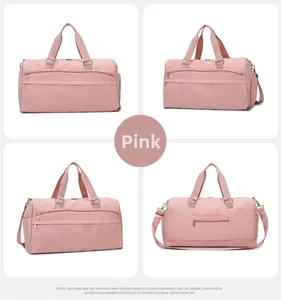 Pink waterproof travel duffel with shoe compartment, multi-pocket design and adjustable strap