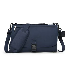 Sac à langer portable bleu foncé avec bandoulière rembourrée réglable pour les voyages