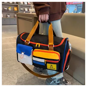 Detail view of the multi-pocket design and vibrant color-block pattern on this travel bag