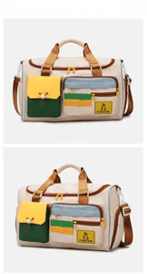 Detail of color-block travel bag with external pockets and adjustable shoulder strap