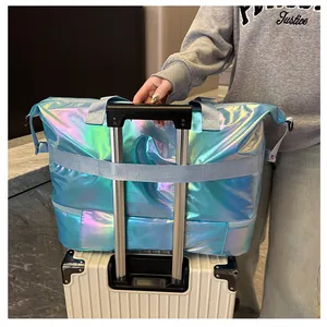 Iridescent travel bag with trolley sleeve attachment shown on a white suitcase handle