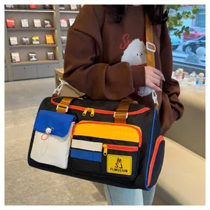 Detail of colorful contrast travel bag with durable nylon material and shoulder strap