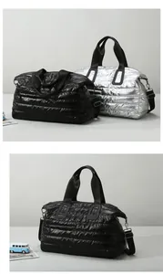 Close-up of quilted waterproof gym bag featuring padded handles and durable side zipper pockets