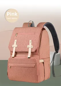 Pink multipurpose diaper bag featuring breathable mesh straps and golden metal buckles