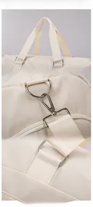 Detail of durable handles, high-strength metal D-rings, and reinforced stitching on travel bag