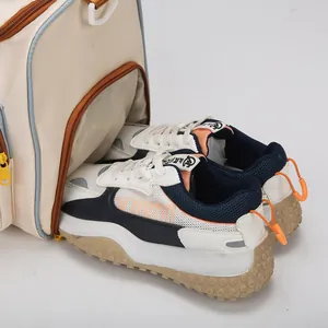 Creamy white travel duffel bag with a functional separate shoe compartment