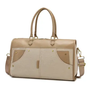 Durable large capacity canvas travel bag with brown leather trim and adjustable strap