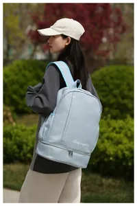 Blue travel backpack featuring a separate bottom shoe compartment and wet pocket