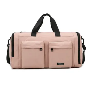 Pink multi-pocket travel bag with independent shoe compartment and black shoulder strap