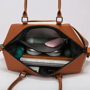 Large capacity canvas travel bag with spacious interior for laptop and essentials