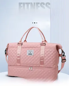 Pink quilted travel bag featuring a separate bottom shoe compartment and wet-dry pocket