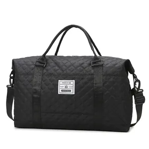 Black quilted travel bag with large capacity for gym and yoga with adjustable strap