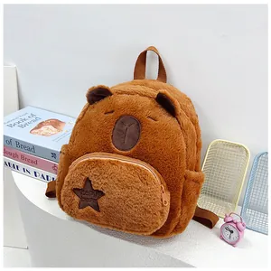 Detail of plush brown Capybara backpack featuring star patch and soft embroidery