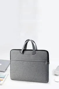 Business laptop bag close-up showing grey Oxford cloth texture and front zipper pocket