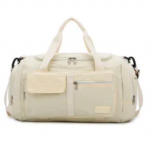 Cream large capacity travel duffel bag with water-resistant nylon and crossbody strap