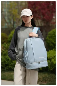 Close-up of light blue travel backpack with a separate bottom dry-wet separation compartment
