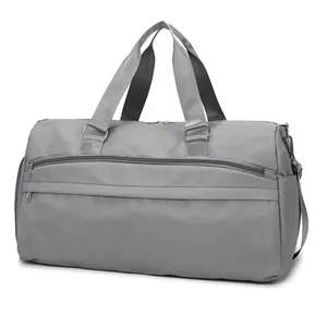 Waterproof grey travel duffel bag with shoe compartment and adjustable shoulder strap