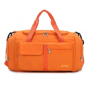Large orange travel bag for gym and yoga with waterproof fabric and detachable straps
