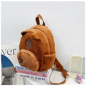 Detail view of brown plush Capybara backpack featuring soft fur and star embroidery front pocket