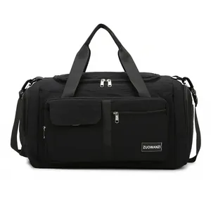 Large black multipurpose travel duffel bag with reinforced handles and shoulder strap